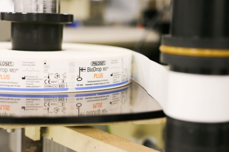 Close-up of medical product labels on a production line prior to packaging.