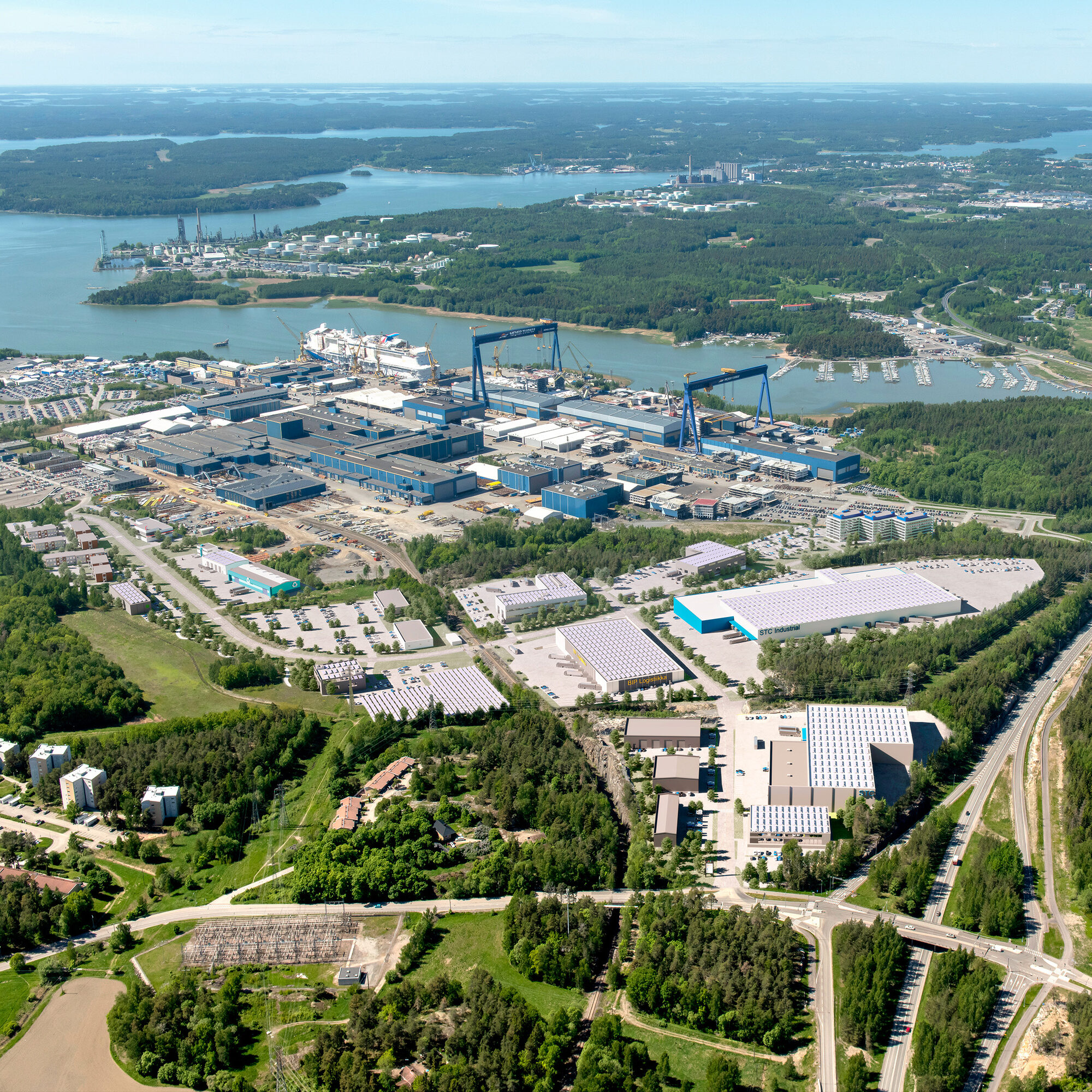 Meyer Turku Shipyard and conceptual drawing of new buildings.