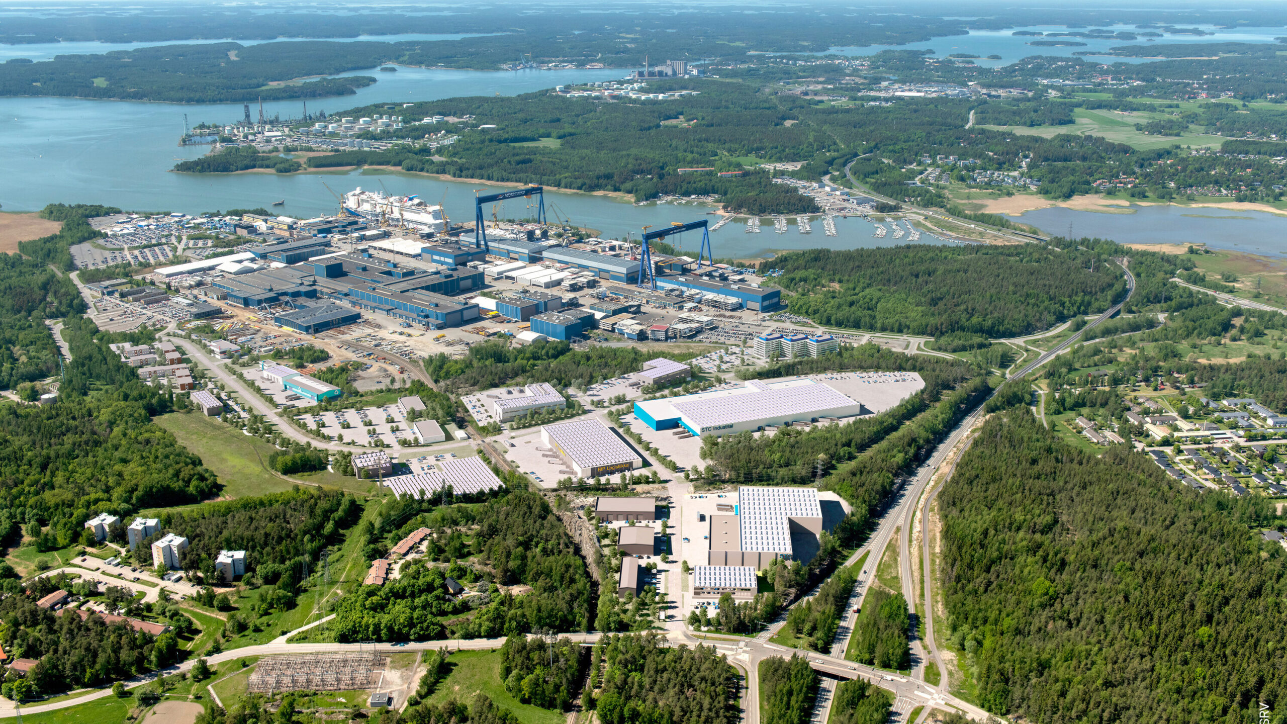 Meyer Turku Shipyard and conceptual drawing of new buildings.