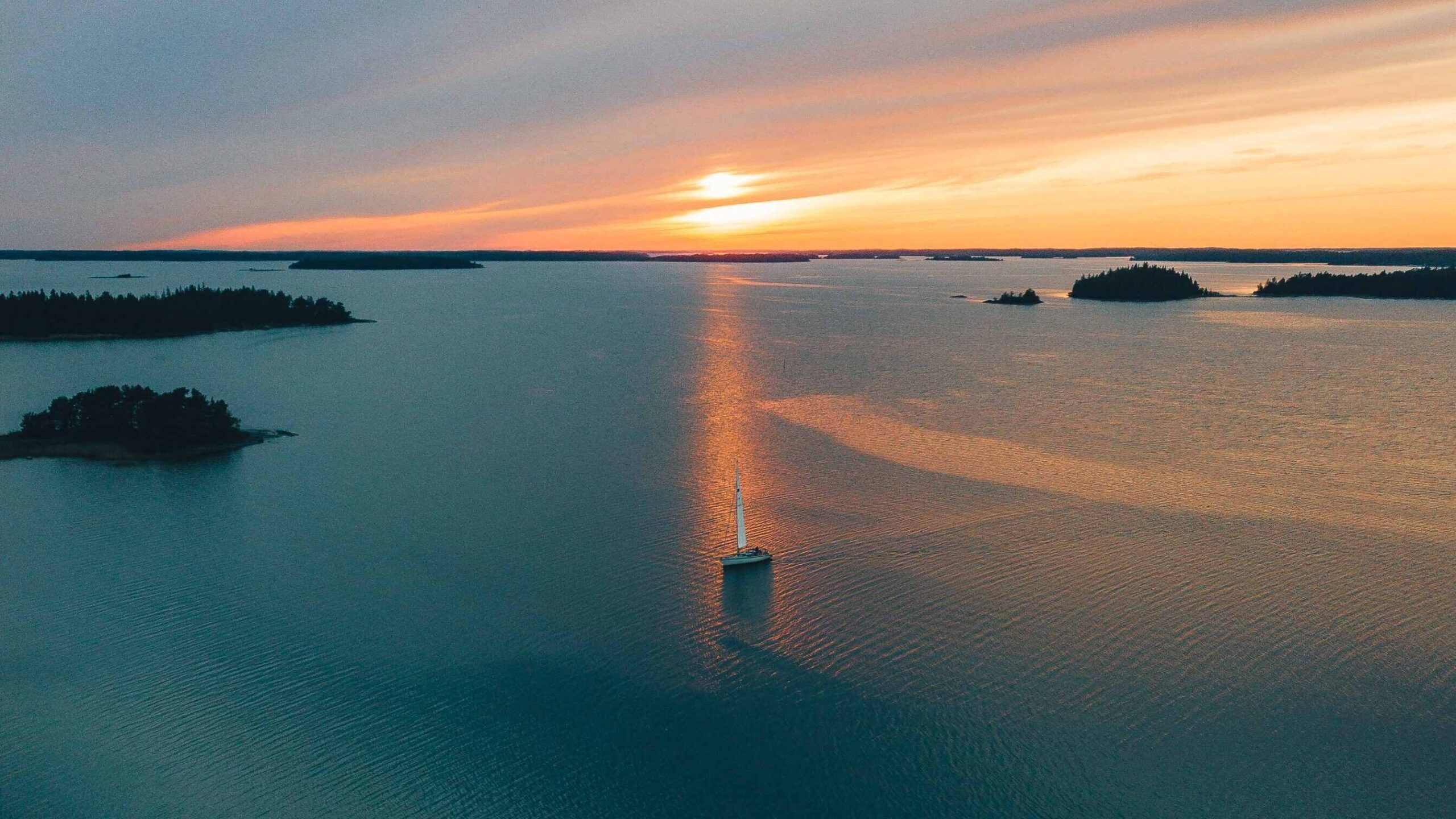 Sailing boat on Archipelago in a sun set.