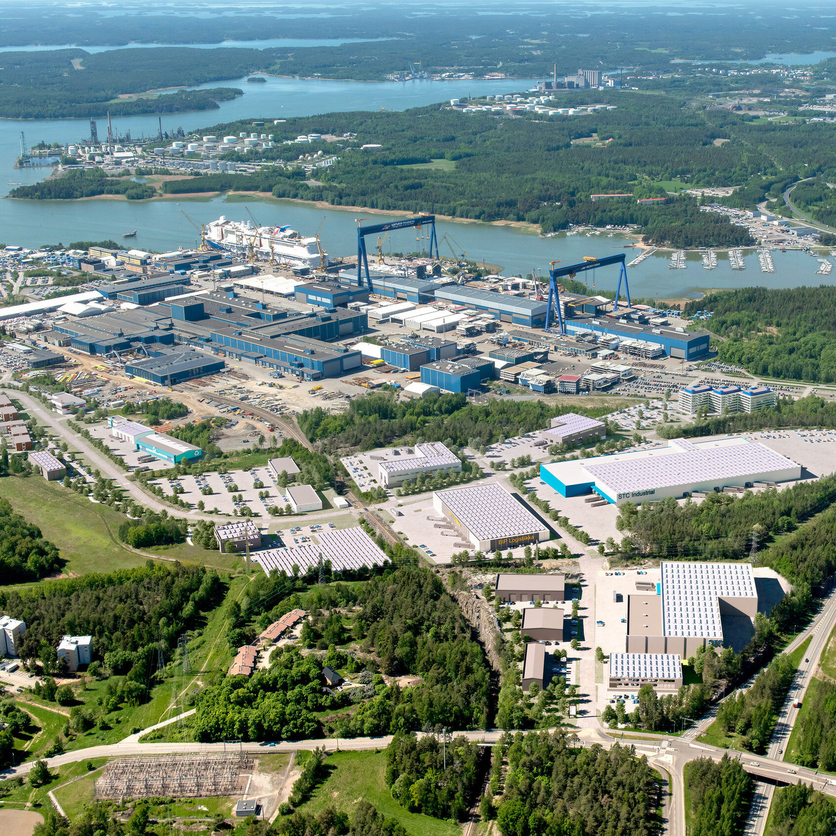 Meyer Turku Shipyard and conceptual drawing of new buildings.