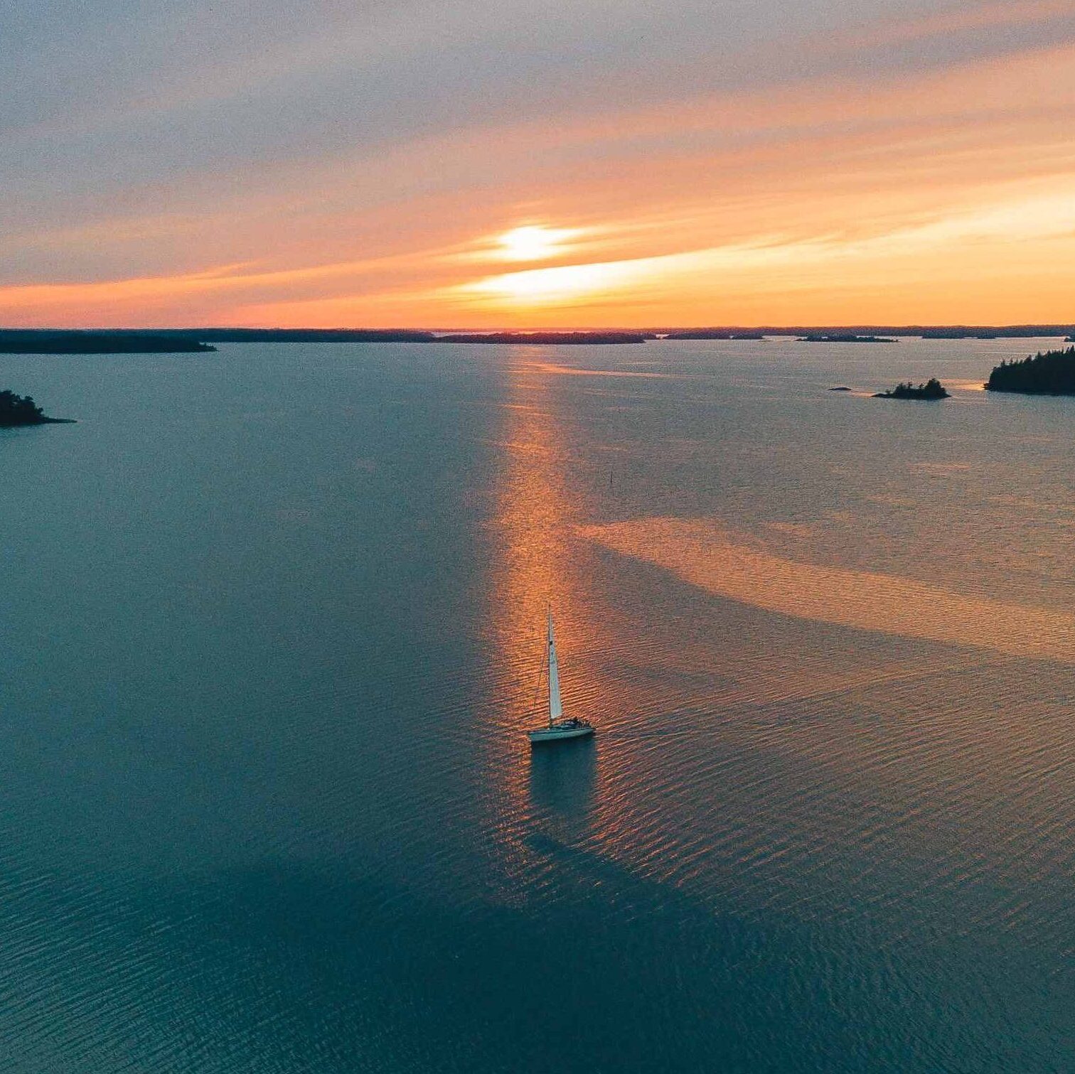 Sailing boat on Archipelago in a sun set.